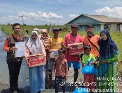 Distribusi Logistik Lokasi Terdampak Banjir di Desa Tajau Landung